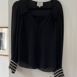 Cinq a Sept size small black crepe blouse with large rhinestone trim on sleeves